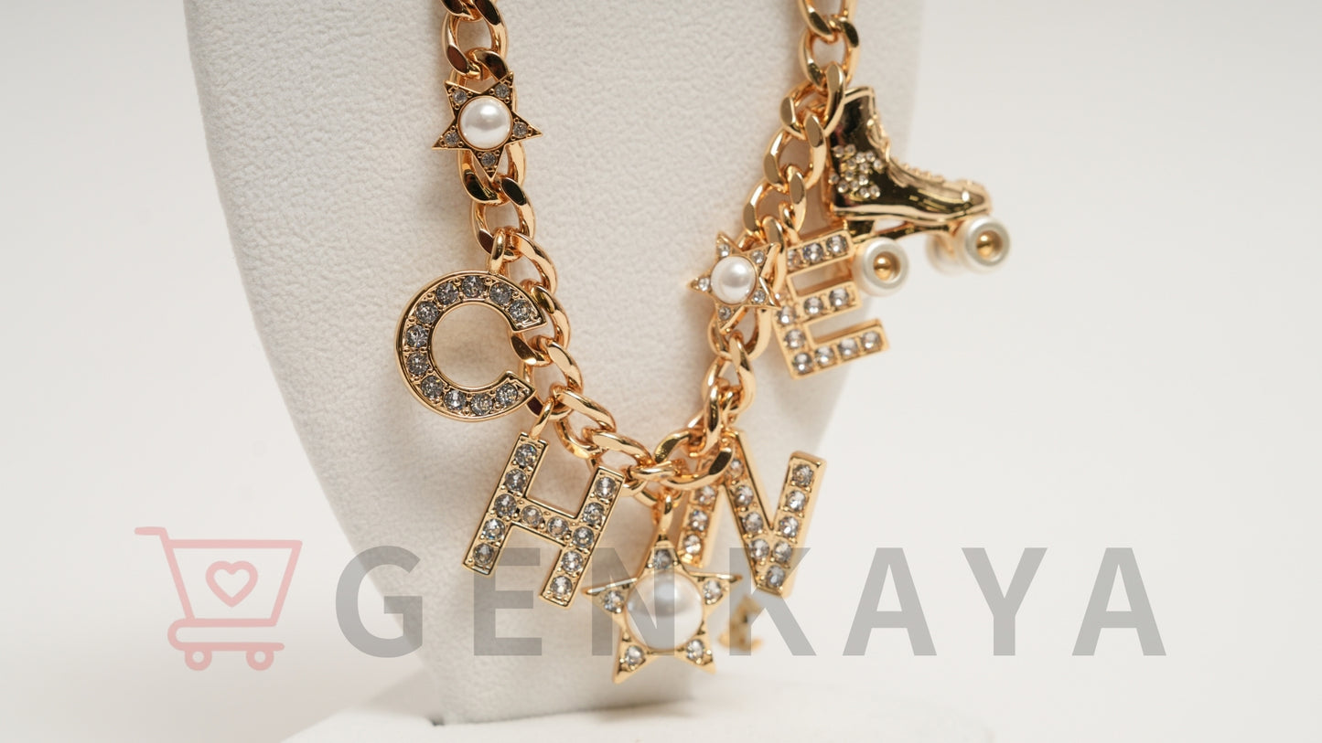 CHANEL C24C GP ロゴ ラインストーン チョーカー ローラスケート ネックレス ゴールド